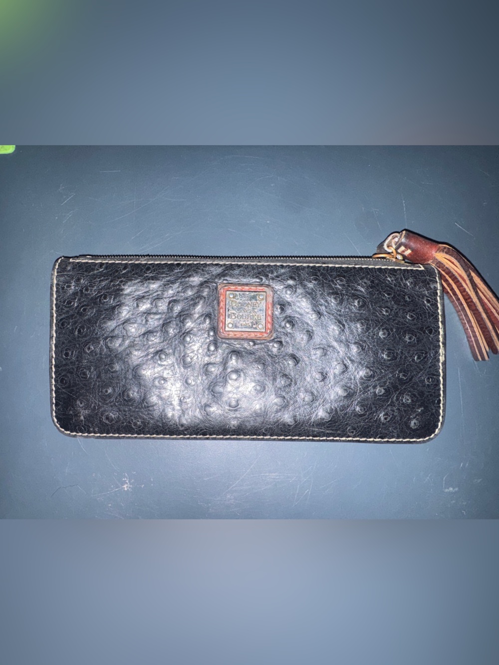 Dooney & Bourke Black Ostrich-Embossed Zip-Around Wallet with Leather Tassel